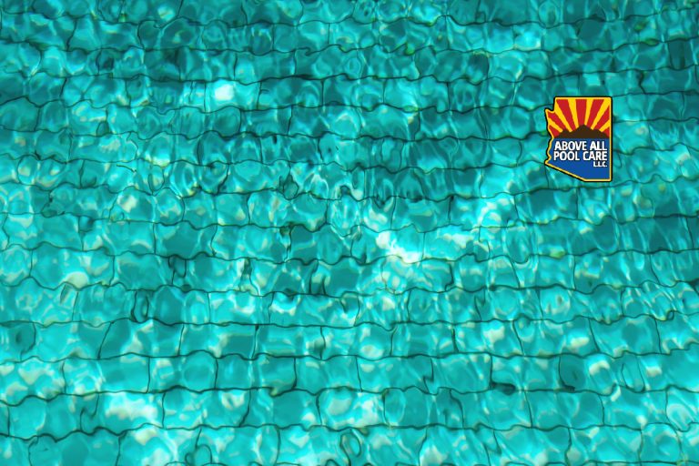 Turquoise swimming pool water background. Copy space, top view. Close up abstract water texture.